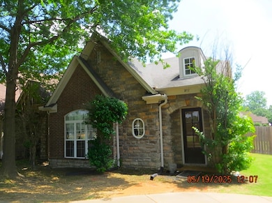 View of front of house with stone siding