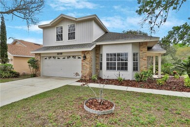 Corner Lot Features Garage Entry, Bay Window, and 