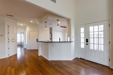 Entrance foyer featuring visible vents, dark wood