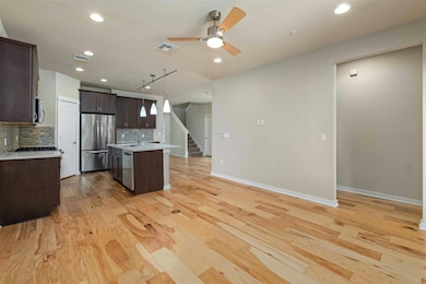 Kitchen opens to living area