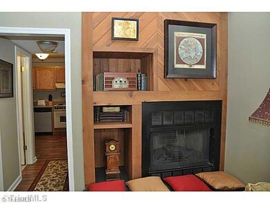 Living Room. Love this fireplace!! Wood accented, built-in bookshelves and your own wood-burning fireplace (seller has never used)