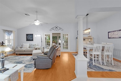 Architectural design elements include pillars & French doors