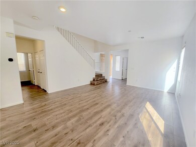 Unfurnished living room with visible vents, basebo