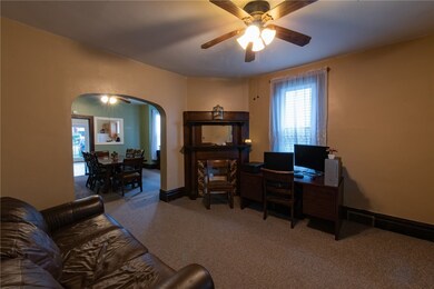 Living room has original fire place, currently use