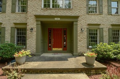 Welcoming front entry with large concrete landing 