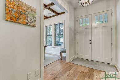 Foyer with formal dining room leading to the kitch