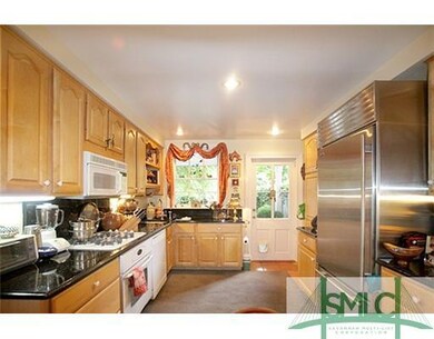 Kitchen. Thie bright kitchen features tile floors,