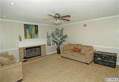 Recessed lights, tile floors & a ceiling fan.