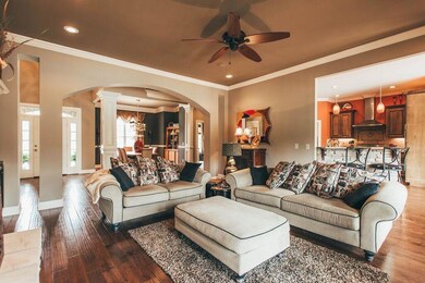 The main family living room is open to the kitchen. The home features 10ft ceilings throughout.