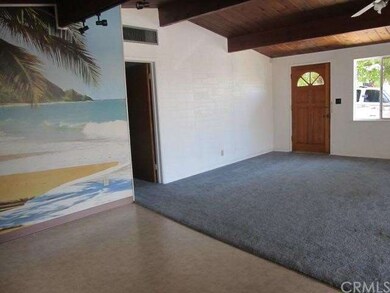 FRONT DOOR LEADING INTO LIVING/DINING AREA