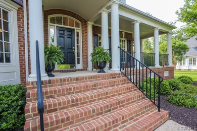 Dramatic brick entrance with sunny side lights and