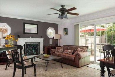 Enter to light and bright living room with brick f