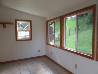 Sunroom has snack bar and TV shelf.
