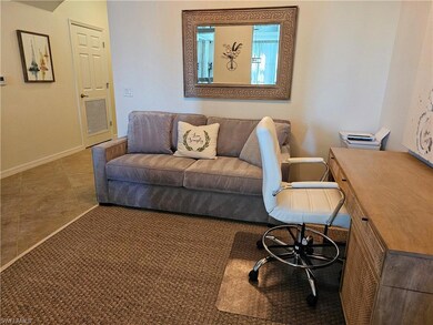 Carpeted home office featuring baseboards