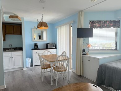 Dining space with light wood-style flooring