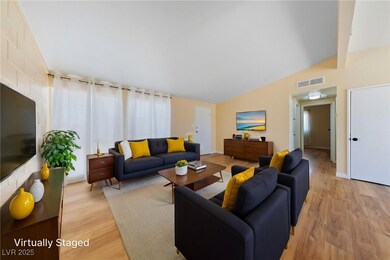 Living area featuring light wood finished floors a