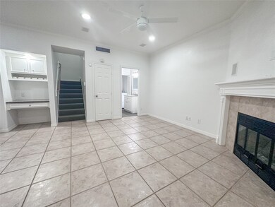 This living space also features a versatile designated workspace that doubles as a stylish wine storage rack—perfect for remote work, organization, or showcasing your favorite vintages.