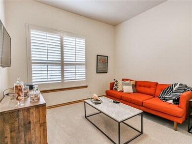 Front office/flex room with plantation shutters an