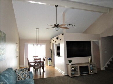 View of the open floor plan and stairs leading to 