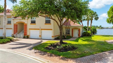 View of front facade featuring a garage, a water v