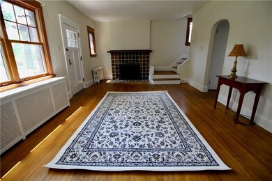 Another view of living room with fireplace.