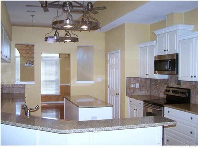 Kitchen view toward dining area
