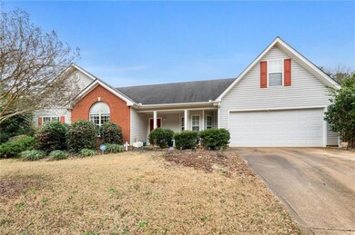 Front of property featuring a garage and a front y