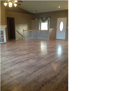 Vaulted ceilings and open living/dining area are w