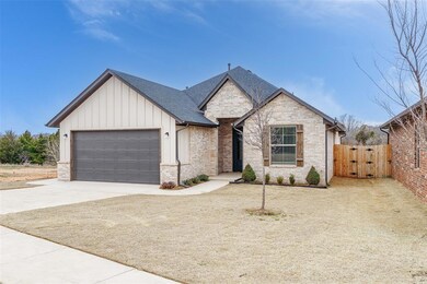 View of front of house featuring brick siding, a s