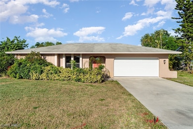 Ranch-style home with stucco siding, driveway, an