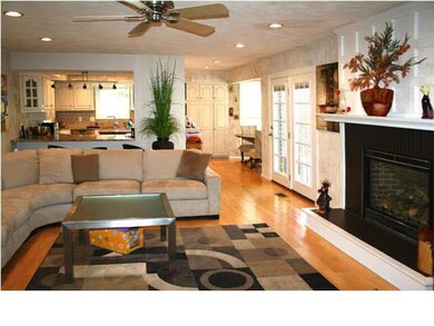 Family room view to kitchen and breakfast nook.