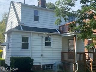 Rear view of house featuring central AC unit