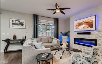 Living area featuring dark wood-type flooring, cei