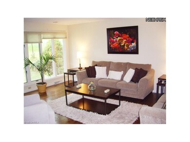 Large bright Living Room with hardwood flooring an