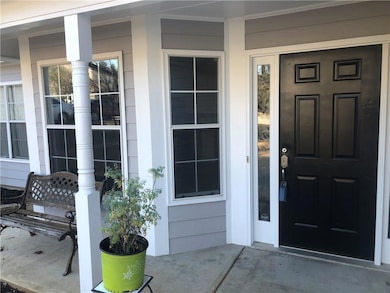 Entrance to property with covered porch