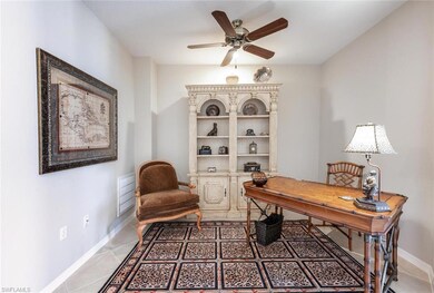 Office with light tile patterned floors, baseboard