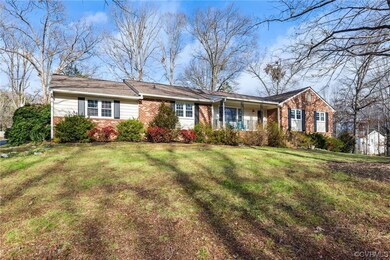 Ranch-style home with a front lawn