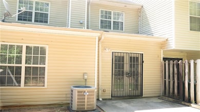 View of exterior entry with a patio