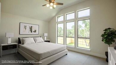 Bedroom with carpet flooring, baseboards, and hig
