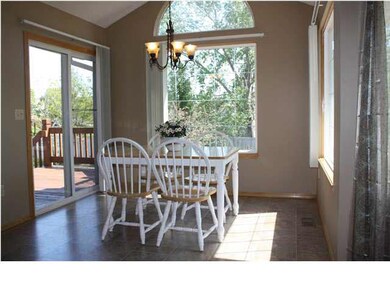 Large kitchen with laminate tile flooring