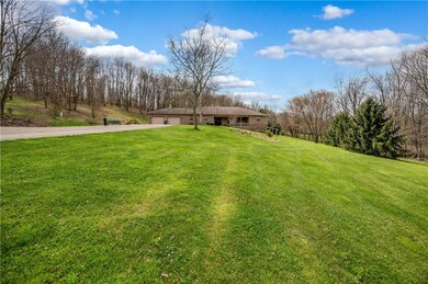 13.44 acres surround this brick ranch home.  A pav