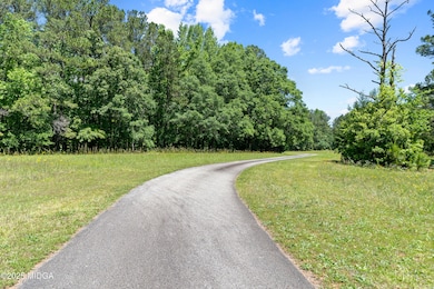 Winding Drive with wooded area and open