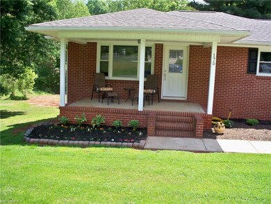 Enjoy quiet afternoons relaxing on the charming front porch.