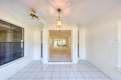 Lanai opens to foyer with matching tile flooring~