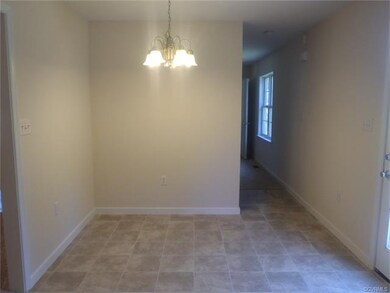 Breakfast nook and rear deck access at kitchen.