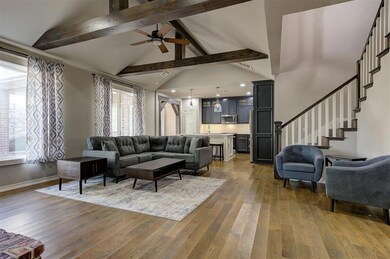 Living room with wood-type flooring, plenty of nat
