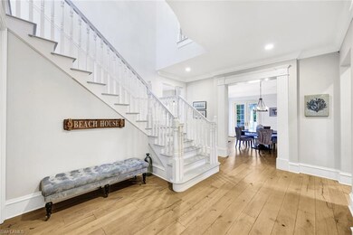 Staircase with hardwood / wood-style flooring, cro