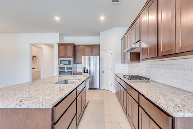 Kitchen featuring appliances with stainless steel