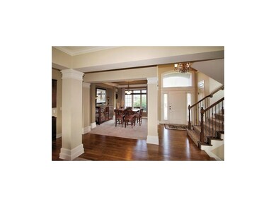 Open floor plan, designer stair carpet and wood en