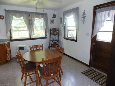 Eat-in kitchen has door opening out to upper tier 